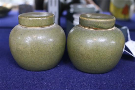 A pair of Chinese teadust glazed small jars and covers, early 20th century, 8cm high